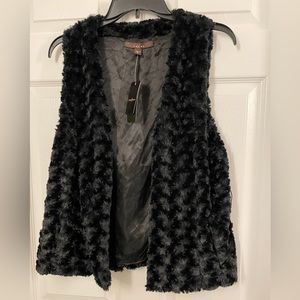 Black fur vest. Size small. Missing belt. Make An Offer
